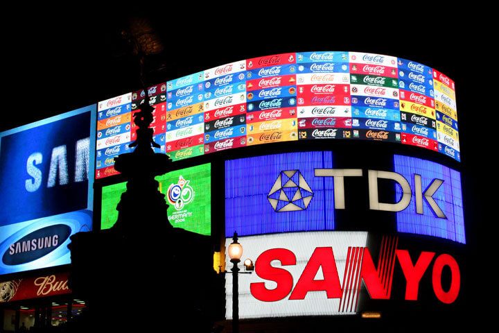 Illuminated Coca-Cola, Samsung, TDK and Sanyo advertising billboards at Piccadilly Circus at night